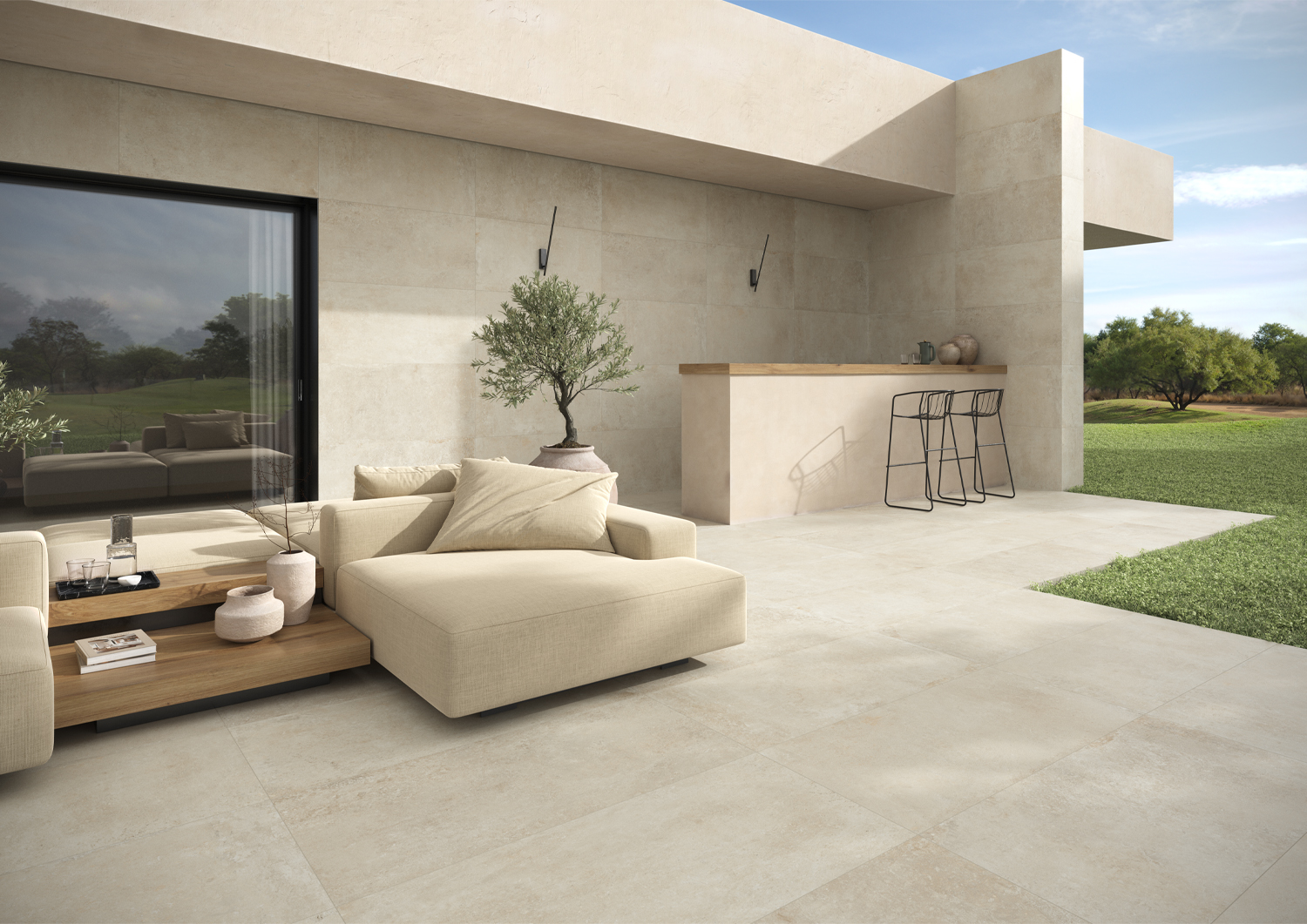 Outdoor terrace with anti-slip stone-effect porcelain tiles flowing from the living room