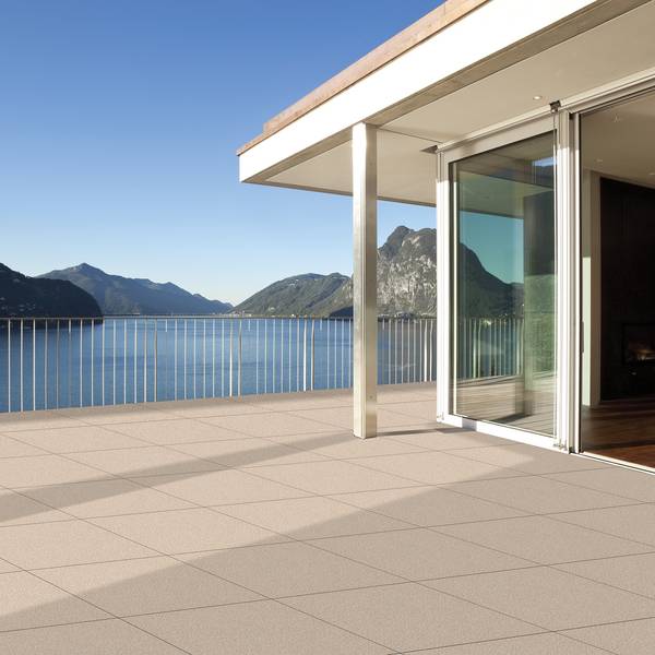 Modern Living room showcasing beige tones with porcelain tiles, creating a luxurious atmosphere.