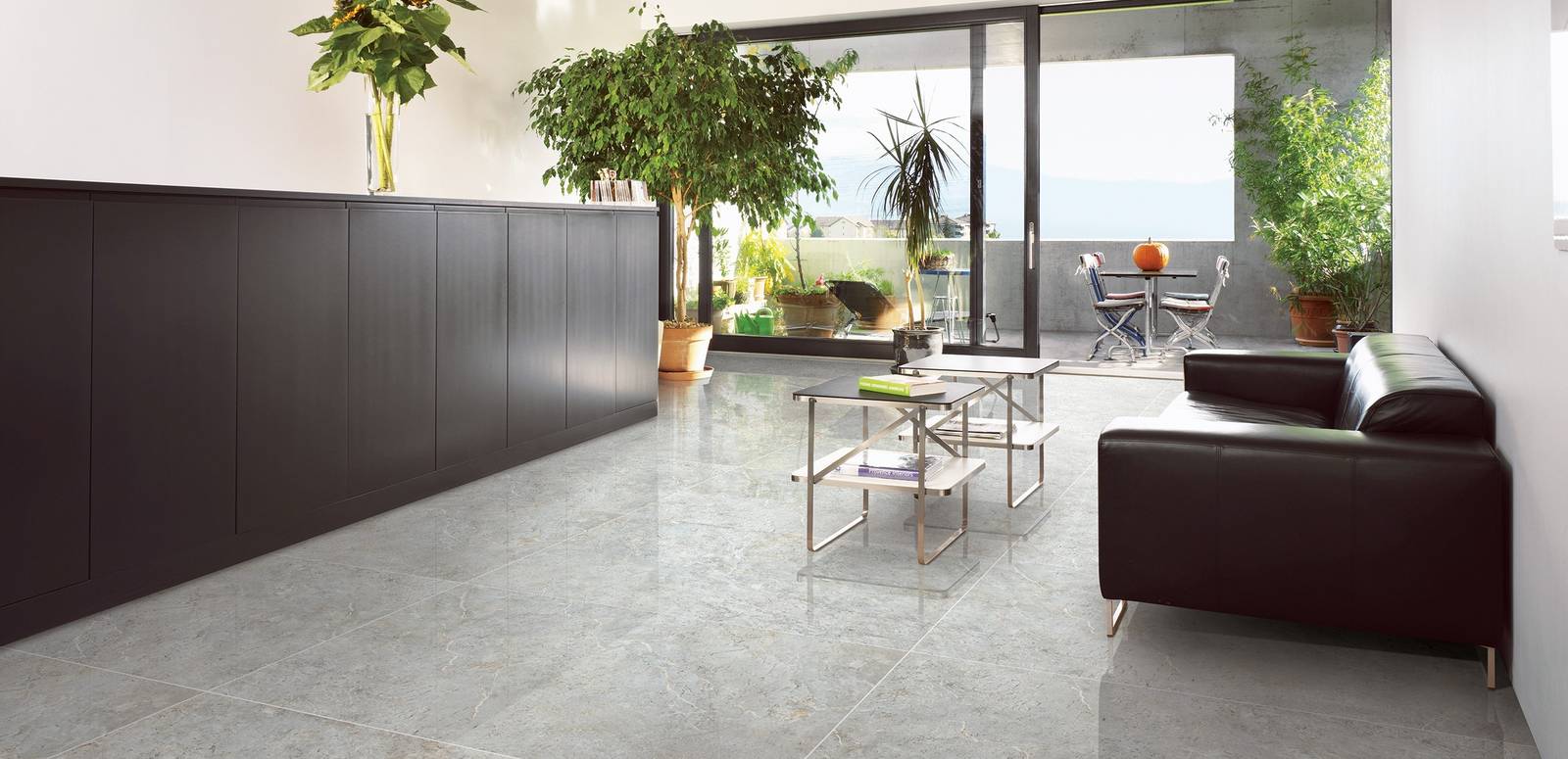 Modern Living room showcasing grey tones with porcelain tiles, creating a serene atmosphere.