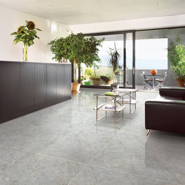 Modern Living room showcasing grey tones with porcelain tiles, creating a serene atmosphere.