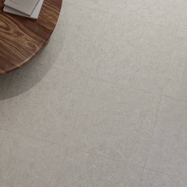 Modern Living room showcasing beige tones with porcelain tiles, creating a contemporary atmosphere.