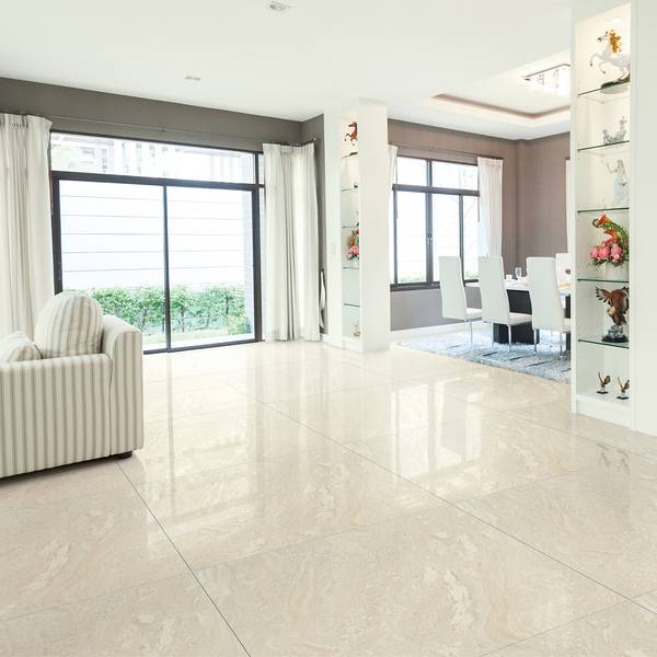Modern Living room showcasing white tones with porcelain tiles, creating a warm atmosphere.