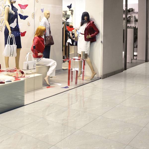 Modern Light Commercial featuring white tones with porcelain tiles, creating a warm atmosphere.